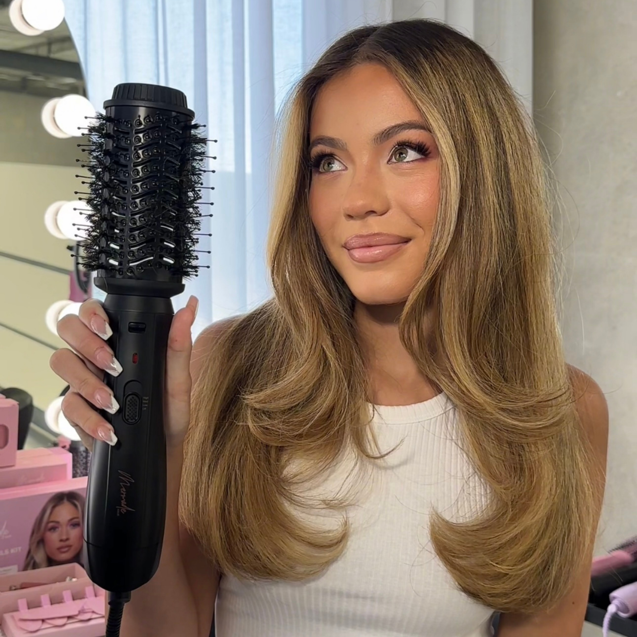 Model using the Mermade Hair Interchangeable Blow Dry Brush - Sleek Black