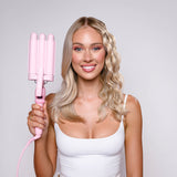 Model holding Mermade PRO Mini Hair Waver - 25mm Pink