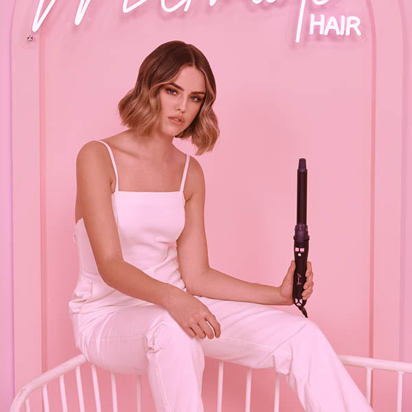 Model holding Black Mermade Hair Spin 
